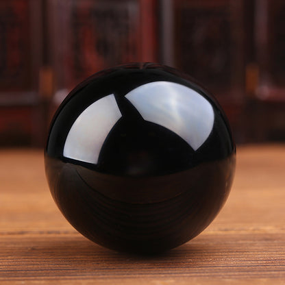 Natural Obsidian Sphere: A Gem of Volcanic Elegance